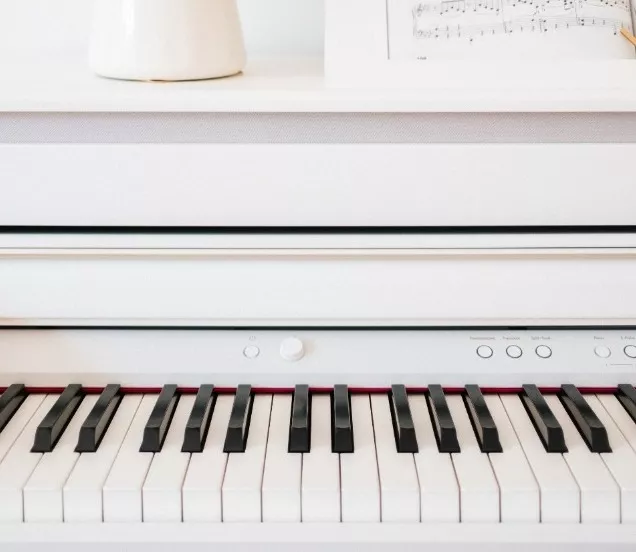 detail of white buffet piano